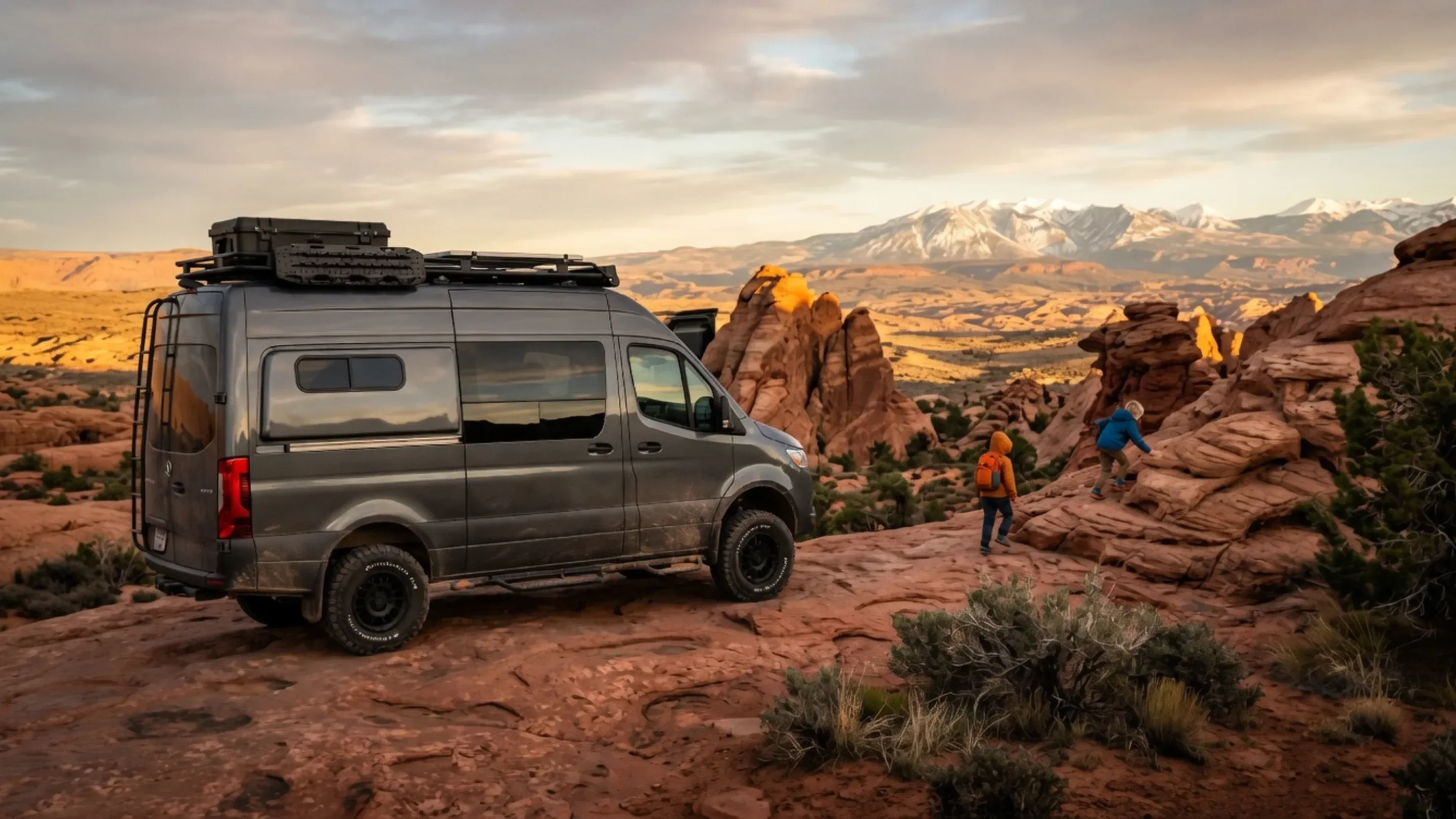 Family off-road rig climbing red sandstone slickrock near Moab
