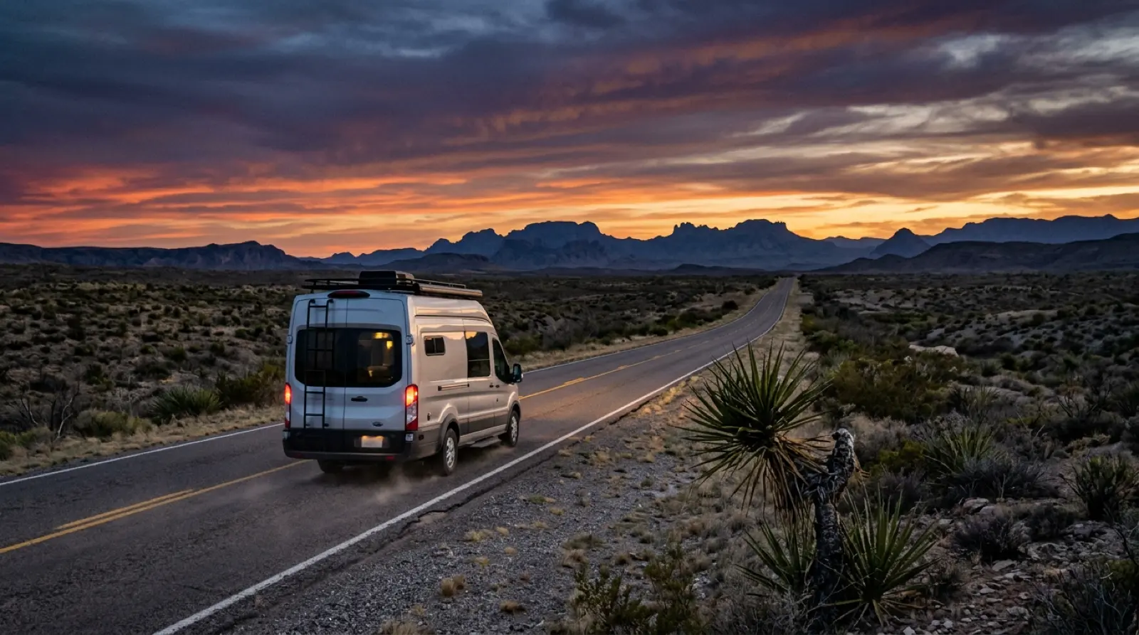 Sample RV route from Austin TX into Big Bend National Park — winding desert highway at dusk