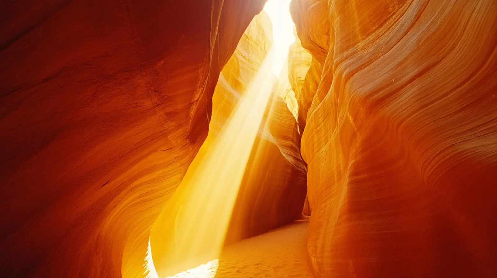 Narrow slot canyon in Utah with twisting red and orange sands